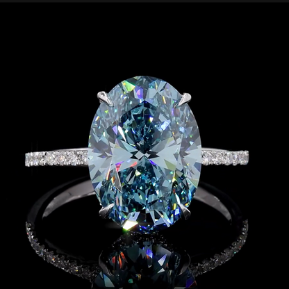 8.18 Ct. Fancy Vivid Blue Oval Diamond Pavé Ring