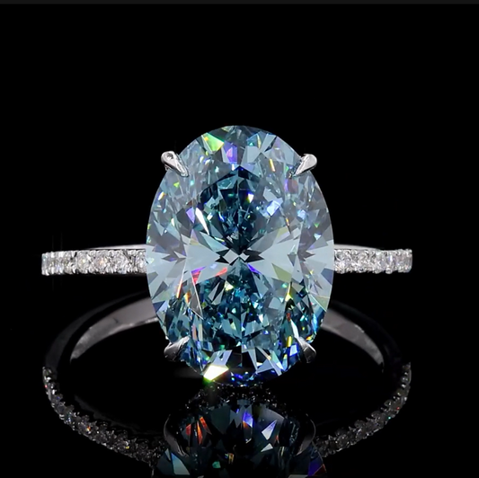 8.18 Ct. Fancy Vivid Blue Oval Diamond Pavé Ring