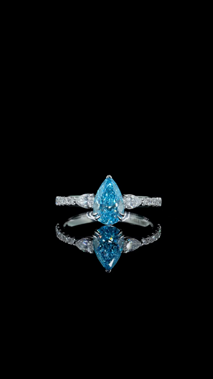 1.23 ct. Blue Diamond Side Stone Ring
