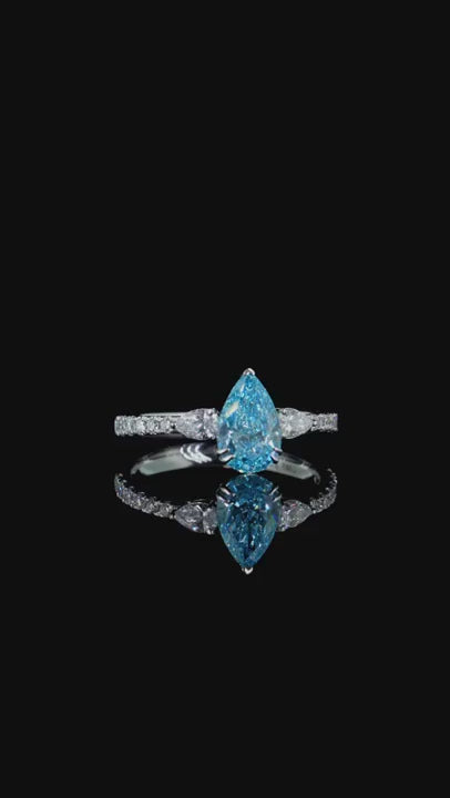 1.23 ct. Blue Diamond Side Stone Ring